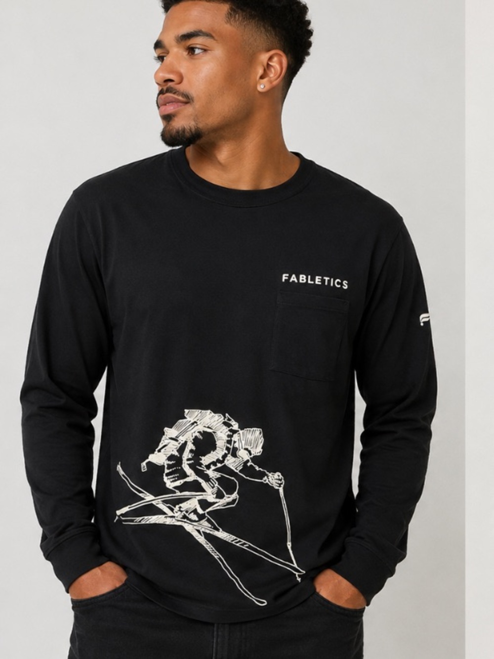Fabletics Men’s Black Long-Sleeve Graphic Pocket Tee with Raised White Ski Print